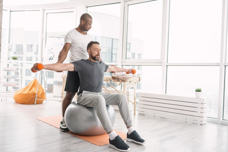 peaceful gym studio with yoga mats, soft lighting, and instructor